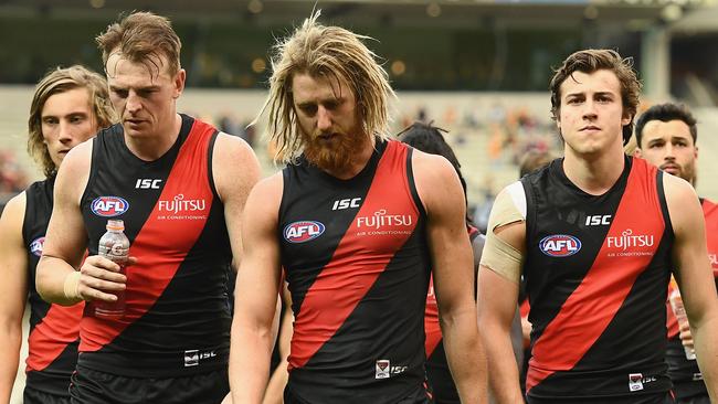 Brendon Goddard, Dyson Heppell and Andrew McGrath walk off the MCG after another loss. Picture: Getty Images