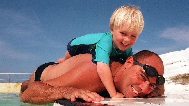 Morri teaching son Mitchell how to swim, 20 years ago. Picture: Bob Barker