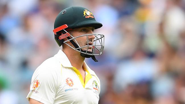 MELBOURNE, AUSTRALIA - DECEMBER 29: Shaun Marsh of Australia walks from the field after being dismissed by Jasprit Bumrah of India during day four of the Third Test match in the series between Australia and India at Melbourne Cricket Ground on December 29, 2018 in Melbourne, Australia. (Photo by Quinn Rooney/Getty Images)