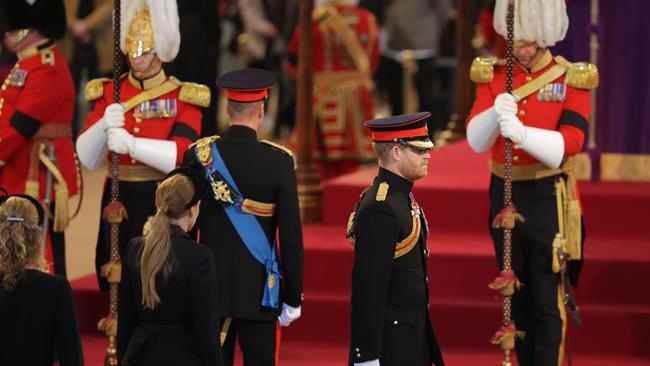 Prince Harry and Prince William take their place during a vigil in honour of Queen Elizabeth II. Picture: Getty Images