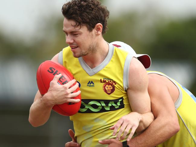 BRISBANE, AUSTRALIA - FEBRUARY 26: Lachie Neale is tackled during a Brisbane Lions joint AFLW & AFL Media Opportunity at Giffin Park on February 26, 2019 in Brisbane, Australia. (Photo by Chris Hyde/Getty Images)