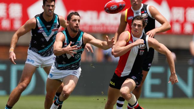 EYES ON THE BALL: Port Adelaide’s Travis Boak and St Kilda’s Jack Steele fight for possession in last year’s Shanghai clash. Picture: MICHAEL WILLSON (AFL Photos).