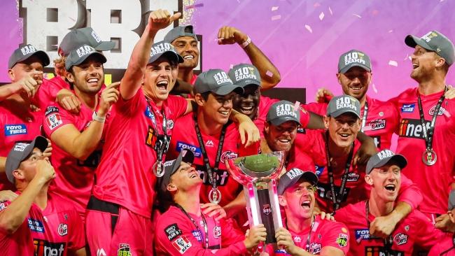 SYDNEY, AUSTRALIA - FEBRUARY 06: The Sixers celebrate victory with the trophy after winning the Big Bash League Final match between the Sydney Sixers and the Perth Scorchers at the Sydney Cricket Ground on February 06, 2021 in Sydney, Australia. (Photo by Hanna Lassen/Getty Images)