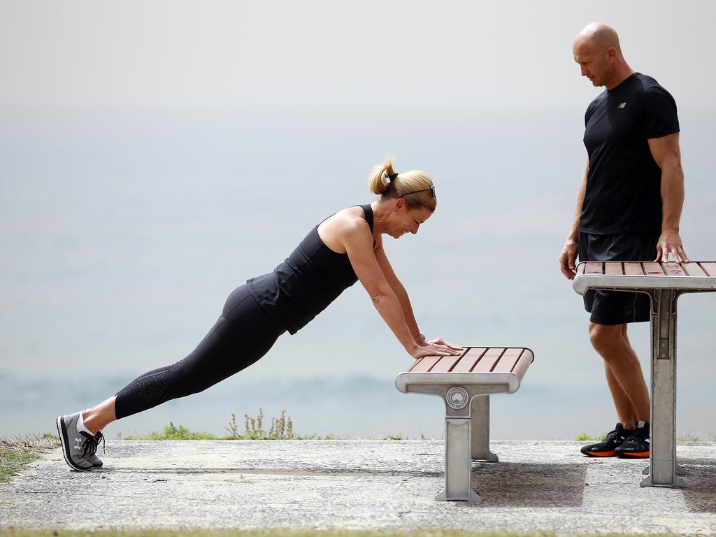 Hutton shows Adam MacDougall how she works out. Picture: Sam Ruttyn