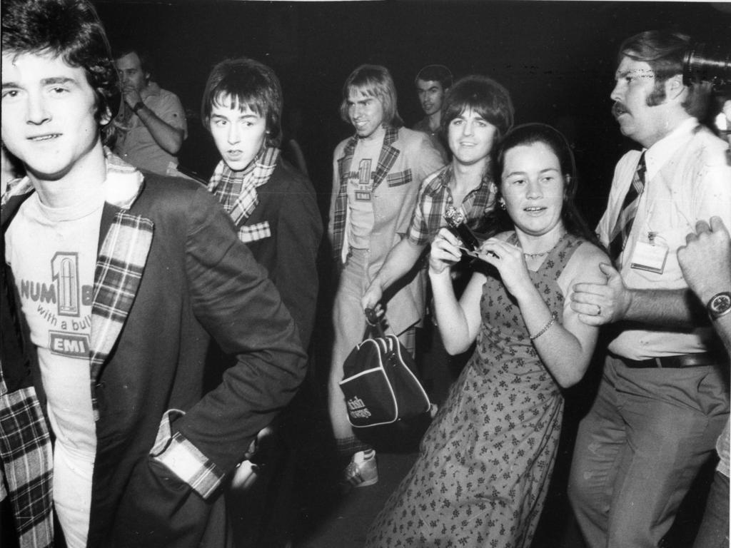 1976 - Michelle O’Gorman of Woody Point was restained by Airport Officials after she got too close to the Bay City Rollers.