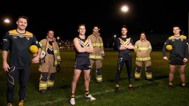 Brighton footballers and firefighters (L-R) Nigel Osborn, Joel Tucker (coach), Bryce Williams, Patrick Gabb, Scott Nerlich, Brad King (assistant coach) and Jay Boyle. Picture: Matt Loxton