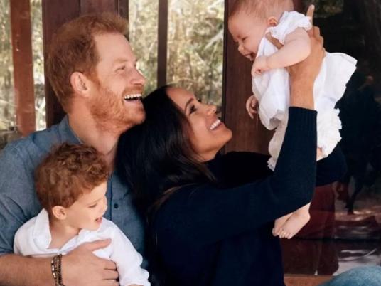 Prince Harry and Meghan Markle with Archie and Lilibet in their 2021 Christmas Card . (Photo by Alexi Lubomirski/Handout/The Duke and Duchess of Sussex)