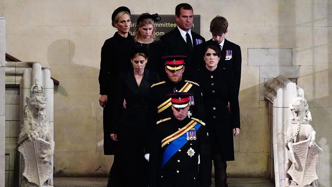 Grandchildren of Queen Elizabeth II, bottom to top, Britain's Prince William, Prince of Wales leads his brother Britain's Prince Harry, Duke of Sussex, followed by their cousins Britain's Princess Beatrice of York and Britain's Princess Eugenie of York, Britain's Lady Louise Windsor and Britain's James, Viscount Severn, and Zara Tindall and Peter Phillips arrive to hold a vigil around her coffin in Westminster Hall.