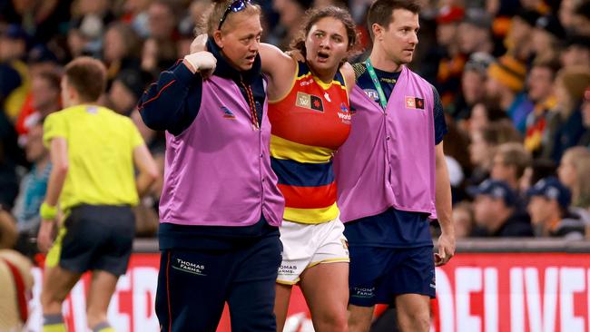 McKenzie Dowrick comes off injured in the third quarter. Picture: James Elsby/AFL Photos via Getty Images