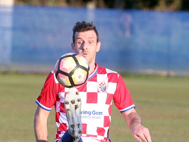 Gold Coast Premier League soccer, Gold Coast Knights (white shorts) vs. Burleigh Heads.Chris Broadfoot.Photo by Richard Gosling