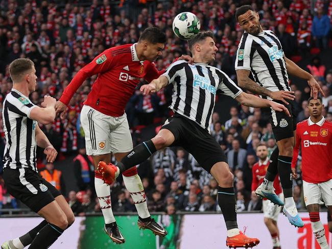 Manchester United midfielder Casemiro (2L) heads home the opening goal of the League Cup final. Picture: Adrian Dennis/AFP