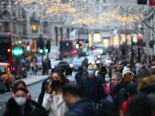 Shoppers wear face masks while walking along Regent Street. Mayor of London Sadiq Khan has declared a major incident in London due to the rise in Omicron cases. Picture: Getty Images