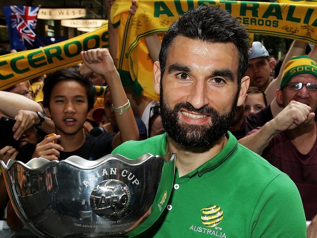 SYDNEY, AUSTRALIA - FEBRUARY 01: Socceroos captain Mile Jedinak poses with the Asian Cup during celebrations at Westfield Sydney on February 1, 2015, after the Socceroos won the 2015 Asian Cup last night, in Sydney, Australia. (Photo by Mark Metcalfe/Getty Images)