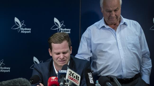 Steve Smith’s father Peter comforts his son during Smith’s emotional press conference at Sydney Airport last year. Picture: Getty Images
