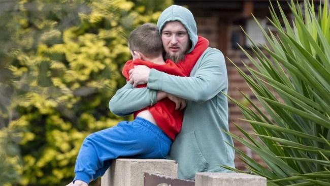 Neighbour Jarrod Hawkins - pictured hugging his son - has been hailed a hero. Picture: NewsWire / Simon Bullard.