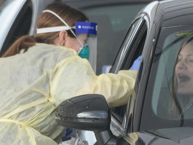 ADELAIDE, AUSTRALIA - NewsWire Photos JULY 01, 2021 -  Lines of cars and health workers at the Victoria Park Covid testing clinic in Adelaide. Picture: NCA NewsWire / Brenton Edwards