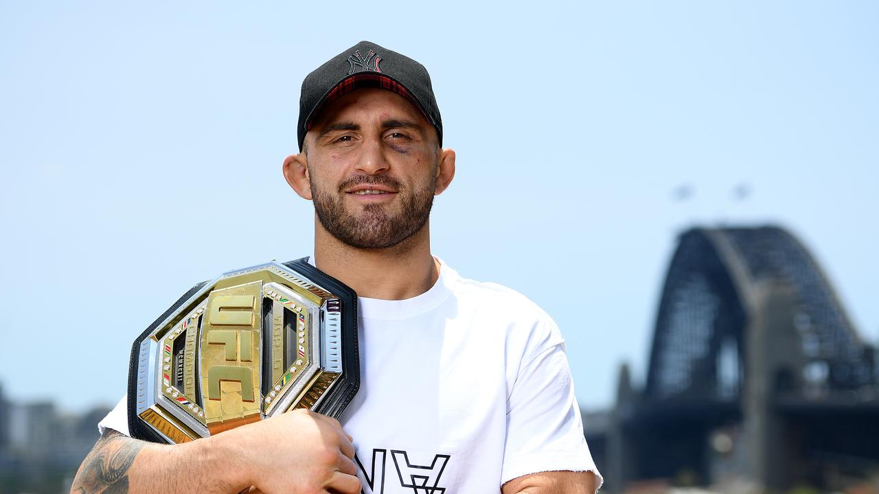 UFC featherweight champion Alexander Volkanovski poses for a photograph with his championship belt back in 2019.