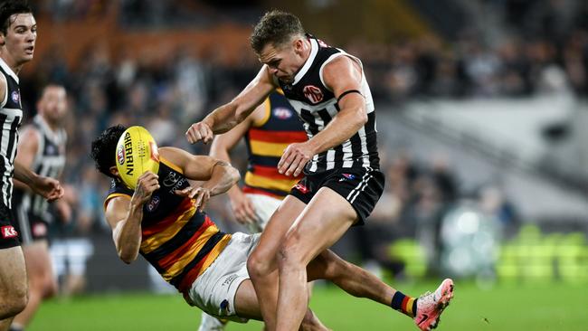 ADELAIDE, AUSTRALIA - AUGUST 17: Izak Rankine of the Crows is knocked out by a late hit from Dan Houston of the Power during the round 23 AFL match between Port Adelaide Power and Adelaide Crows at Adelaide Oval, on August 17, 2024, in Adelaide, Australia. (Photo by Mark Brake/Getty Images)