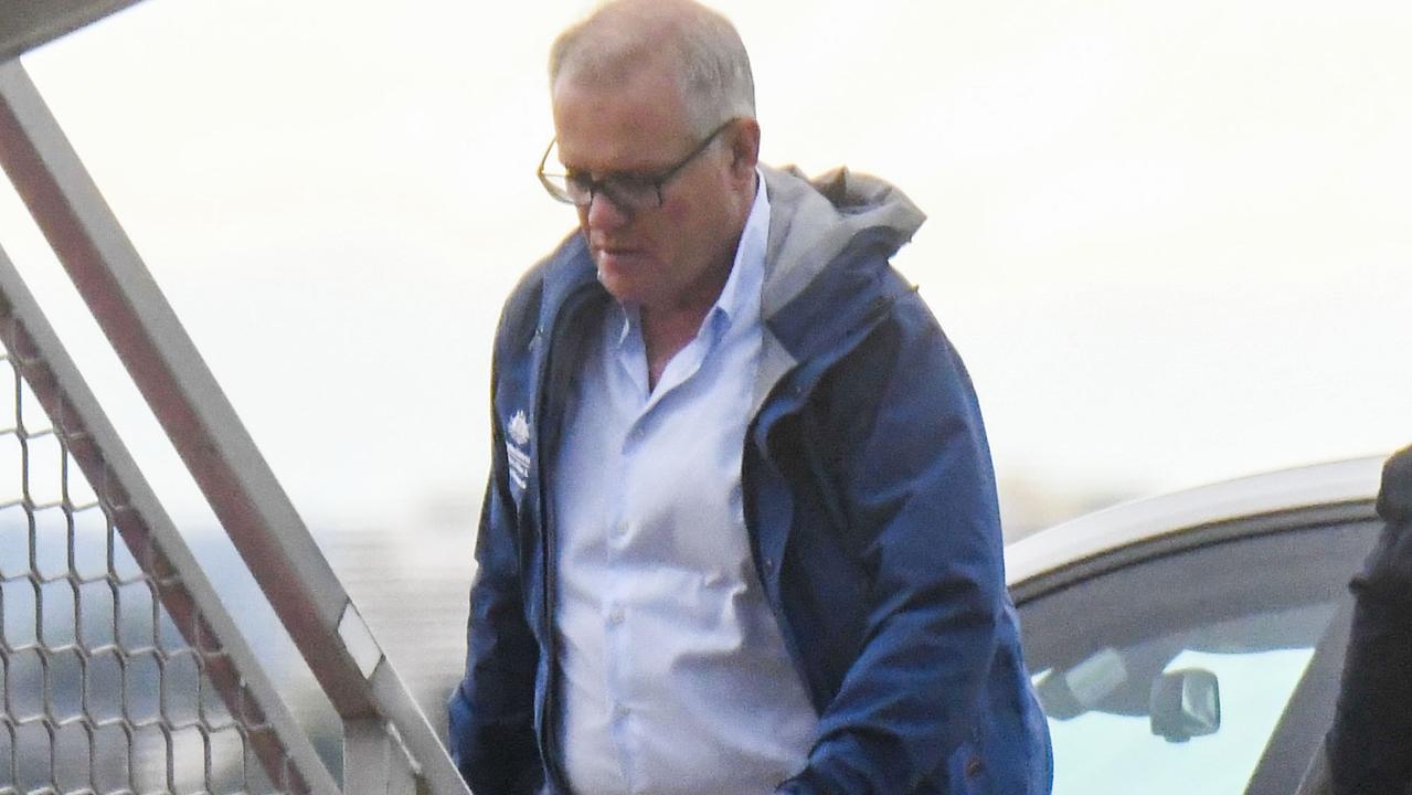 Scott Morrison boarding a plane out of Sydney.