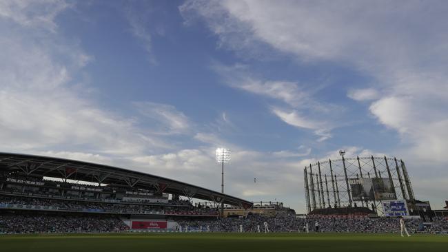 Floodlights take over late on day three. Picture: AP