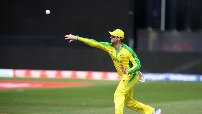 Australia's Steve Smith throws the ball to run out Afghanistan's Mohammad Nabi. Picture: AFP