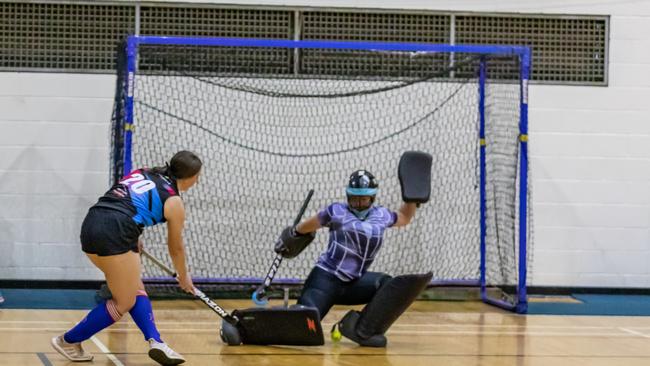 ON TARGET: Toowoomba Funnel Webs under-15 goalkeeper Bobbie Hamlet attempts to shut down Jane Butler's shot at goal. Photo: Visual Hope Photography