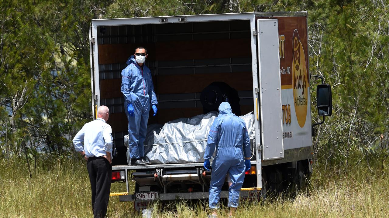 Police load the metal box which they retrieved out of a dam onto a truck. (AAP Image/Dan Peled)