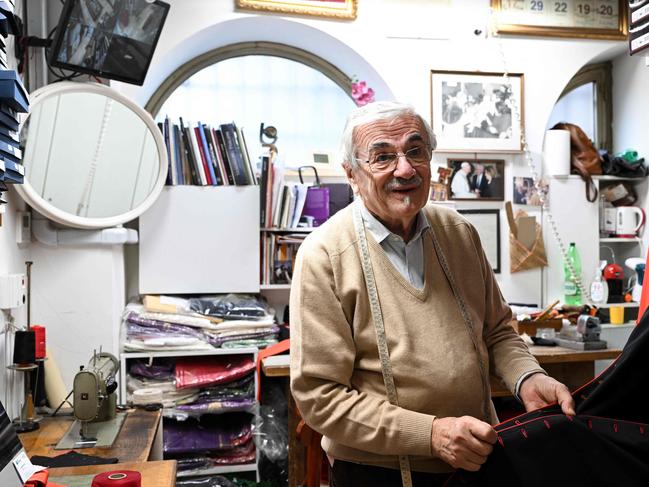 Italian ecclesiastical tailor, Raniero Mancinelli, 86, works on a cardinal's cassock in his shop in Borgo Pio, a neighbourhood close to the Vatican. Picture: AFP