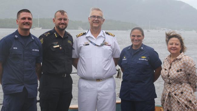 The US Coast Guard's Lieutenant Channing Meyer, Australian Border Force's Deputy Commander Neil Horne, Royal Australian Navy's Michael Gulyas, Commander Nicole Tesoniero and US Consul General Christine Elder aboard the USGC Harriet Lane in Cairns. Image: Samuel Davis