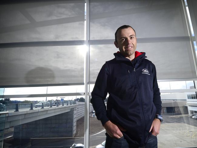 Tim Decker is coach of Olympic hopeful Glenn O'Shea and is travelling to London for the games. Pictured at Adelaide Airport ready to check in.