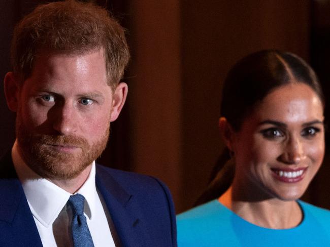 (FILES) In this file photo taken on March 05, 2020 Britain's Prince Harry, Duke of Sussex (L), and Meghan, Duchess of Sussex leave after attending the Endeavour Fund Awards at Mansion House in London. - In a new documentary series set for release May 21, 2021 Prince Harry is once again emphasizing that his family turned a blind eye to the struggles of his wife Meghan Markle, saying he will "never be bullied into silence." (Photo by JUSTIN TALLIS / AFP)