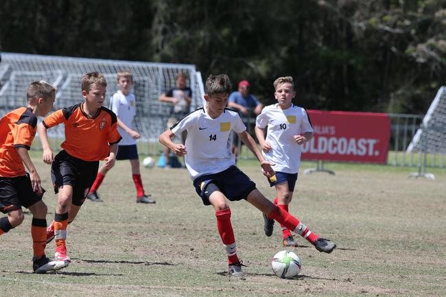 The Premier Invitational football tournament on the Gold Coast. Brisbane Roar Orange v TFC Brisbane White under-13s in action. Picture: Mike Batterham.