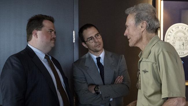 Sam Rockwell and Paul Walter Hauser with director Clint Eastwood on the set of Richard Jewell.