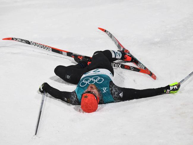 Germany’s Thomas Bing collapses following the men’s cross-country individual sprint classic quarterfinal at the Alpensia cross country ski centre during the Pyeongchang 2018 Winter Olympic Games on February 13, 2018 in Pyeongchang. Picture: AFP