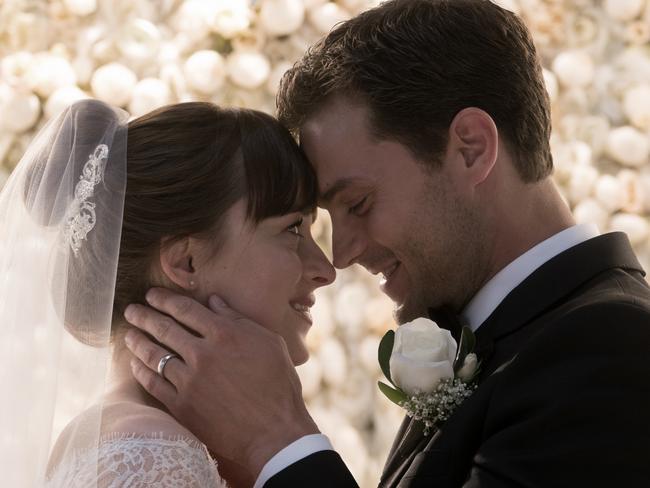 Dakota Johnson and Jamie Dornan as a happy married couple in Fifty Shades Freed.