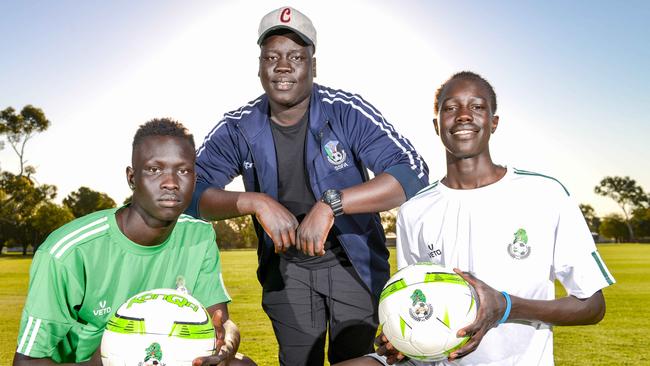 Nile United players Awal Dut and Jok Akuien with coach Arok Akoi Arok at Kalara Reserve in Davoren Park. Picture: Brenton Edwards