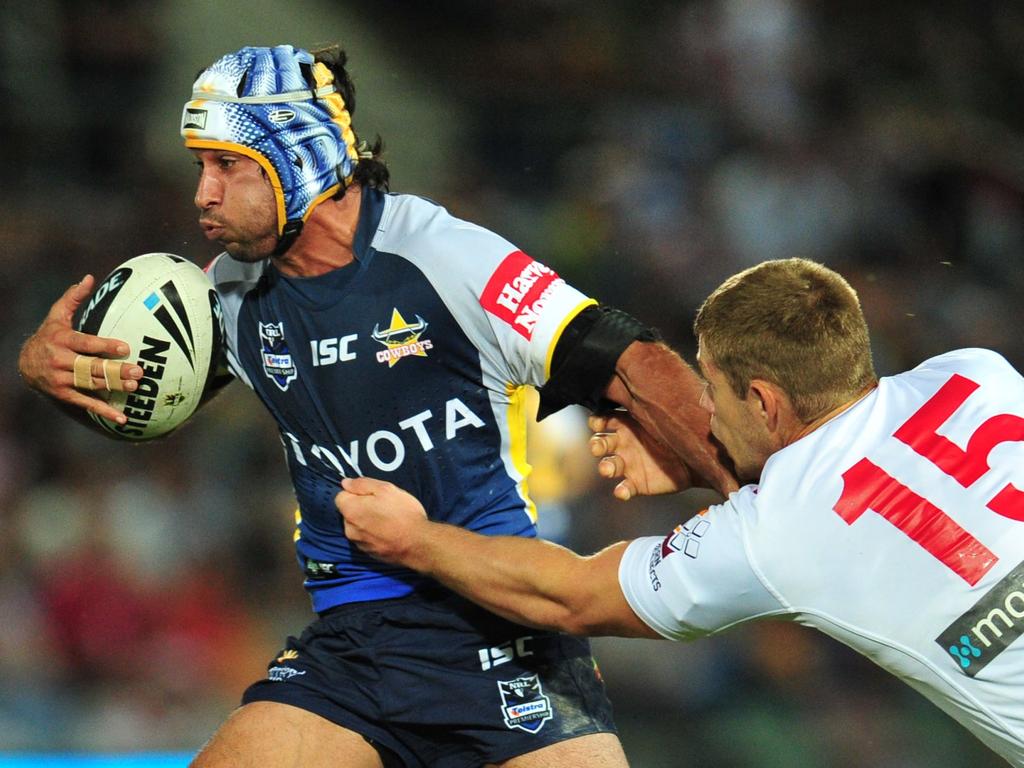 North Queensland Cowboys against St George Illawarra Dragons at Dairy Farmers Stadium. Cowboys' Johnathan Thurston and Dragons' Jeremy Latimore.