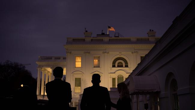 White House staff look at the residence of the White House as US President Donald Trump continues to challenge the results of the 2020 US Presidential Election. Picture: AFP