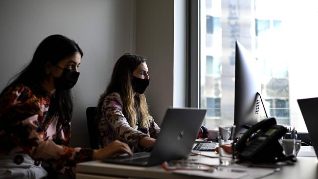 Experts predict the post-COVID workplace will see the emergence of a hybrid working week model where employees work some days in the office and some from home. Picture: AFP