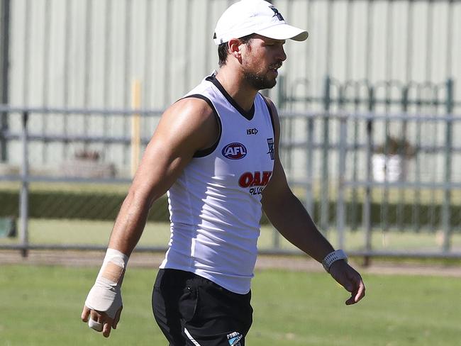 Travis Boak with his right hand strapped. Picture Sarah Reed