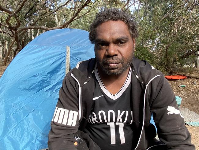 Bruce Leo-Morris in front of his tent which he lives  in at the Safer Place to Gather campsite at Edwards Park.