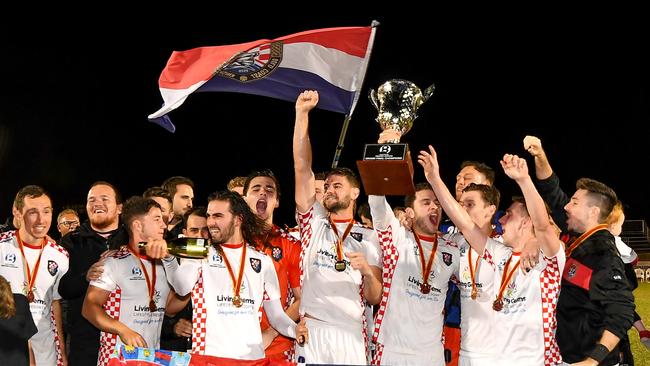 Gold Coast Knights players celebrate after winning the NPL Queensland grand final.