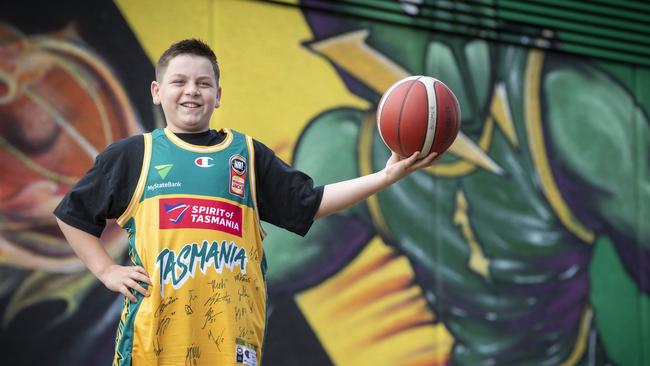 JackJumpers jersey winner Brady "Boomer" Bluett at the JackJumpers mural, MyState Bank Arena. Picture: Chris Kidd