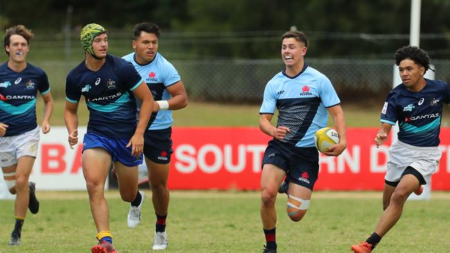 Joe Walsh of NSW makes a break.