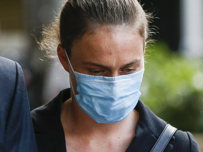 SYDNEY, AUSTRALIA - NewsWire Photos APRIL 28, 2021: Leaving Downing Centre Court, Sydney, is Jennifer Wood (wearing mask) who is accused of assaulting and tying up a four-year-old with a disability at a childcare centre. Picture: NCA NewsWire / Dylan Robinson