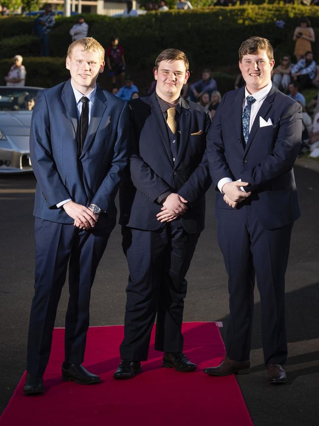 Arriving at Harristown State High School formal are (from left) Alex Anderson, Logan Coonan and Liam Lawson at Highfields Cultural Centre, Friday, November 18, 2022. Picture: Kevin Farmer