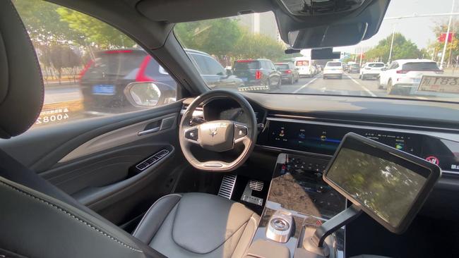 The driver’s seat of a Baidu Apollo Go robotaxi, as it negotiated Wuhan’s early evening rush hour. Picture: Will Glasgow