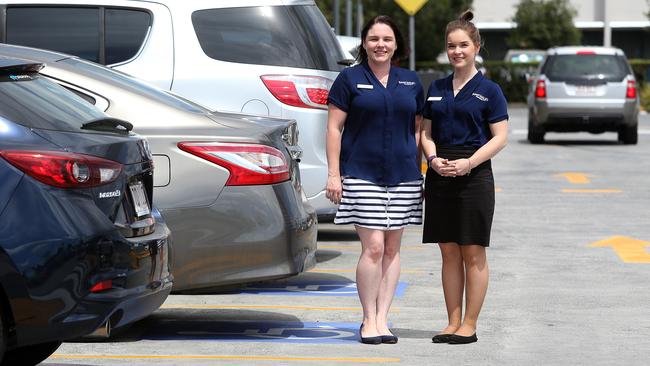 Beenleigh Marketplace centre management staff Kelly Ferguson and Megan Lattimer say their centre has more than the required number of disabled parks, which are stringently patrolled. AAP Image/Jono Searle