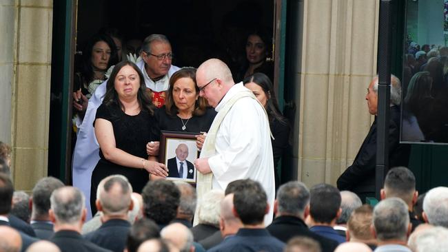 John Latorre’s wife Maria and daughter Antoinette leaving the funeral. Picture: NCA NewsWire