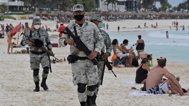 Members of the Tourist Security Battalion of the Mexico National Guard patrol a beach in Cancun in 2021. (Photo by Elizabeth RUIZ / AFP)